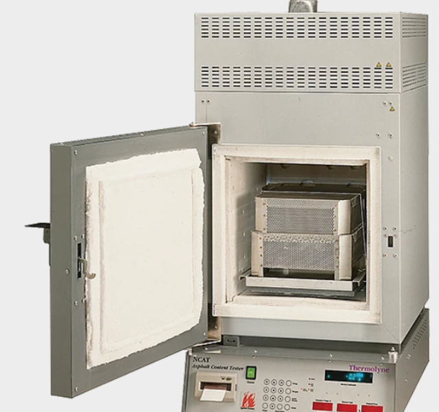 Asphalt Content/Binder Ignition Furnace Supports the following standards: ASTM D6307, AASHTO T308  Key Features:  Asphalt content of bituminous paving mixtures is accurate to 0.11% Accommodates samples up to 5000g Operating Features:  Automatic Mode: